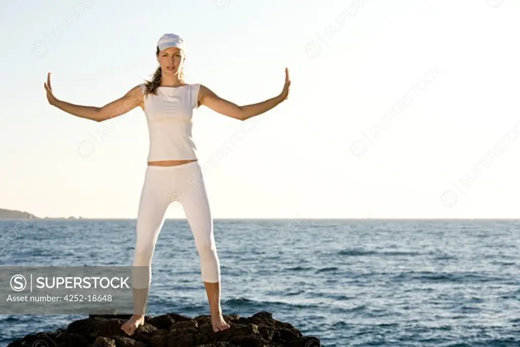 Woman sea yoga.