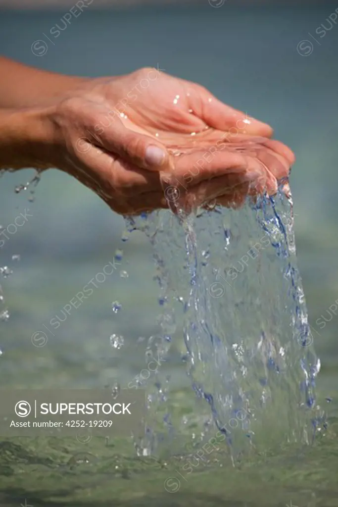 Woman hands sea water