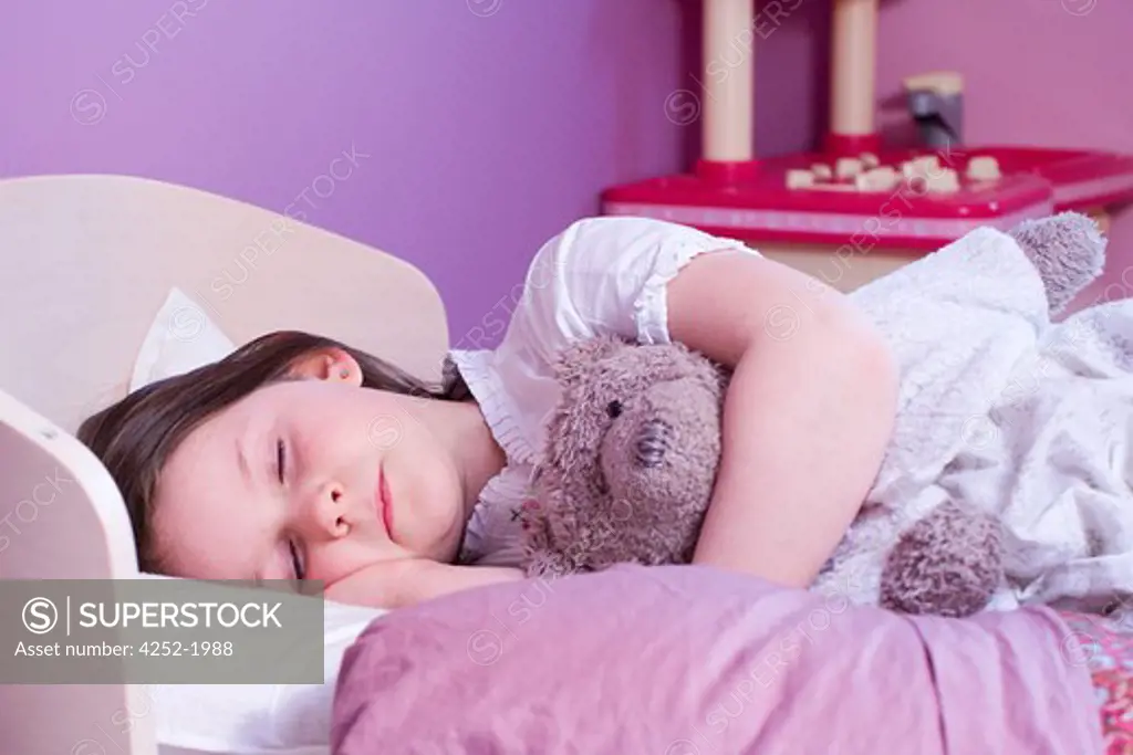 Little girl sleep stuffed animal