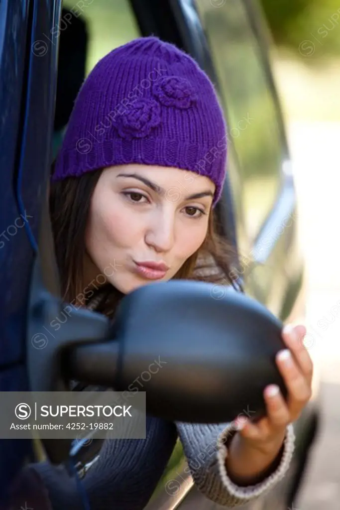 Woman rearview mirror car