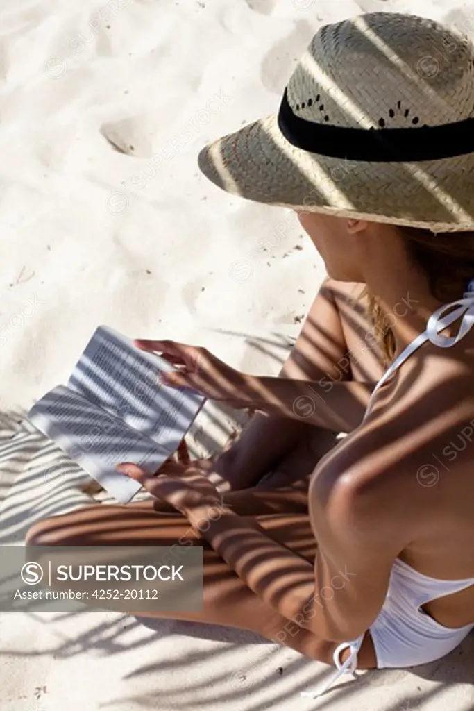 Woman beach reading