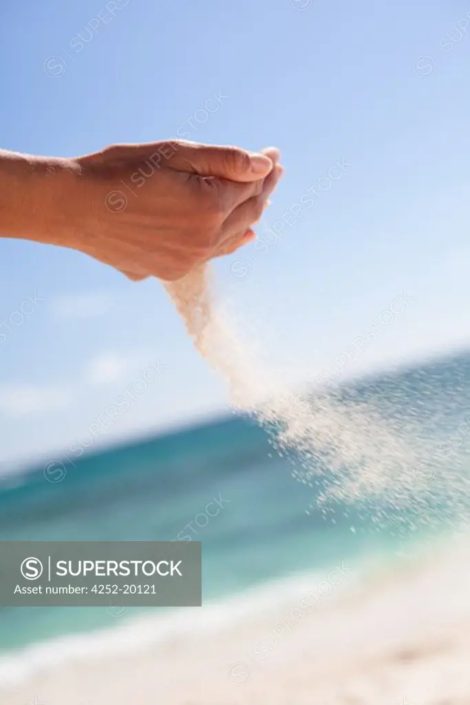 Woman hands sand