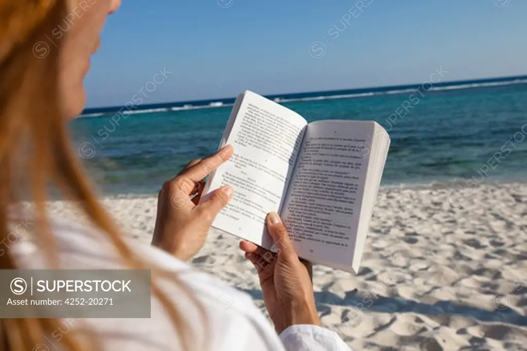Woman beach reading