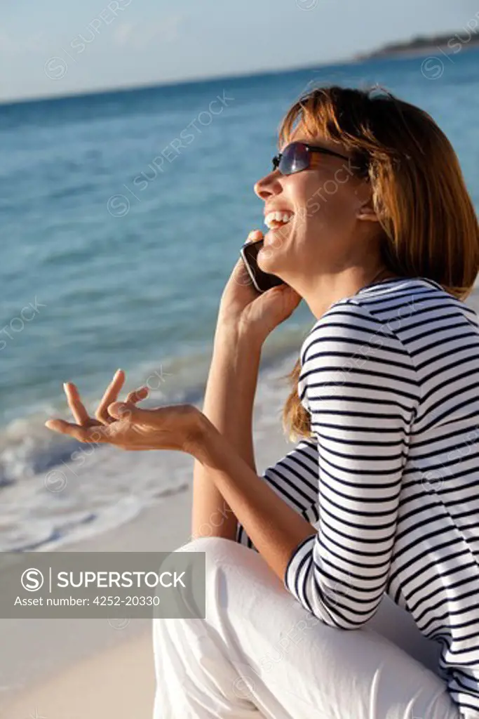 Woman beach phone