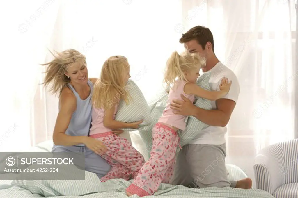 Family throwing pillows