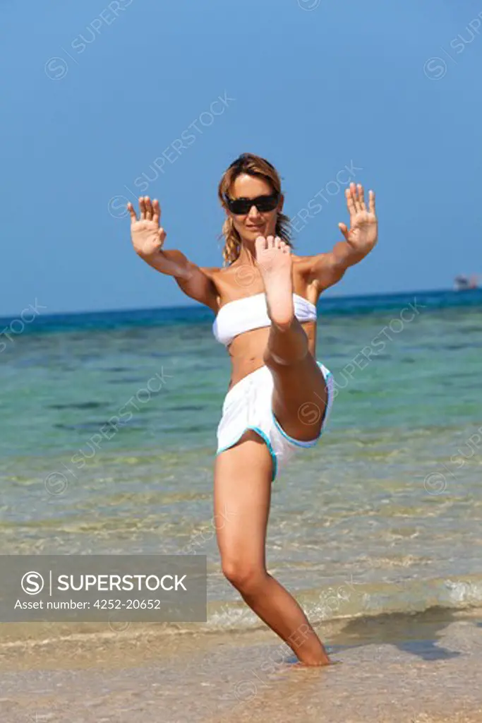 Woman beach tai chi