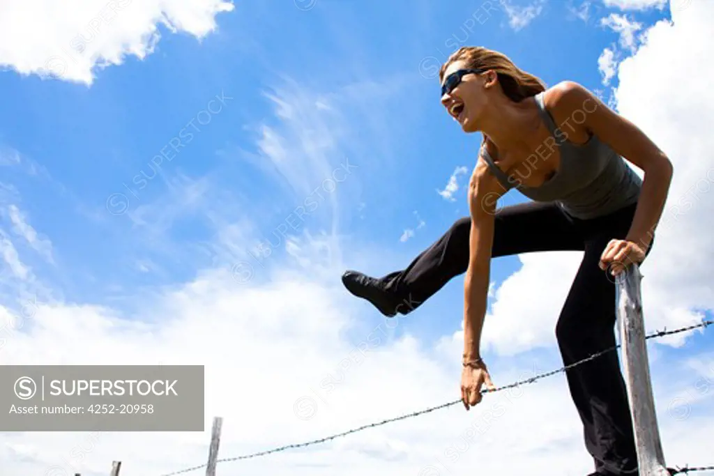 Woman barbwire jumping
