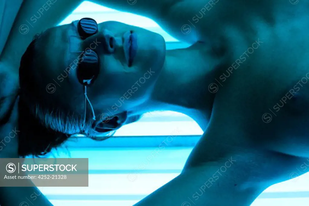 Woman UV rays sunbed