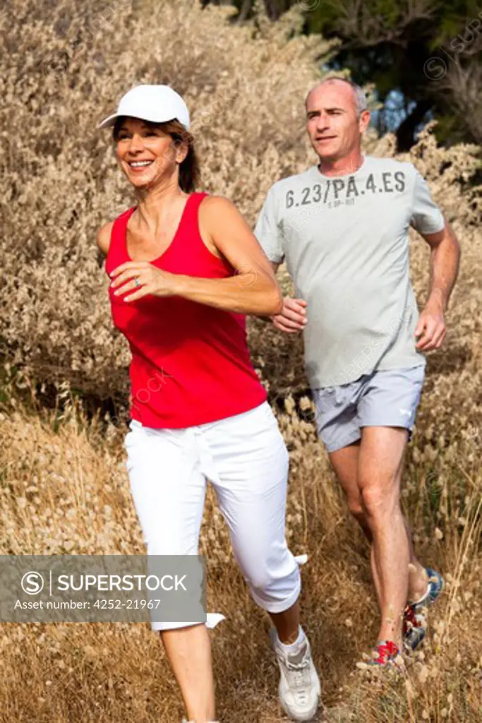 Senior couple running