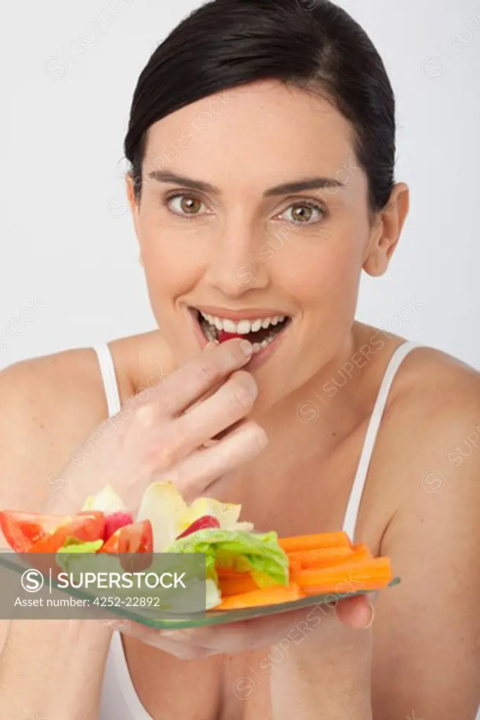 Woman raw vegetables
