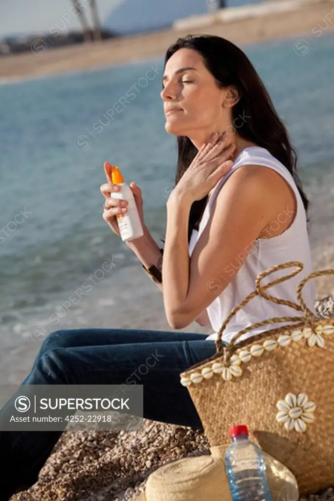 Woman suntan lotion
