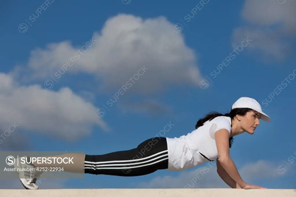 Woman gym push ups