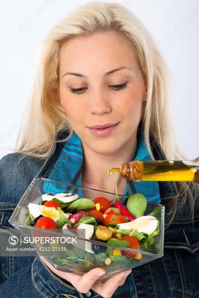 Woman olive oil salad