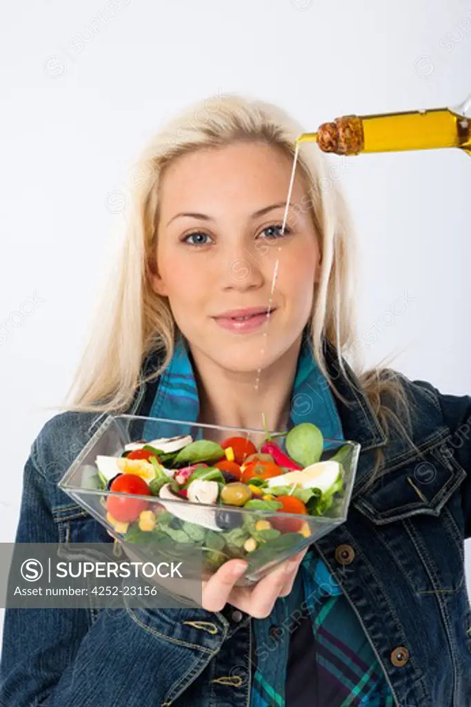 Woman olive oil salad