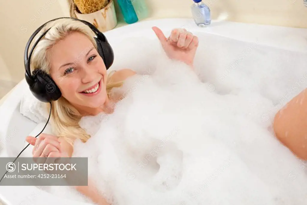 Woman music headphones bath