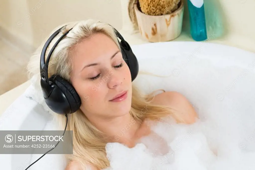 Woman music headphones bath