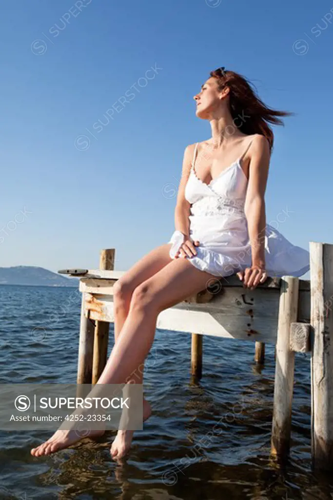 Contemplative woman sea