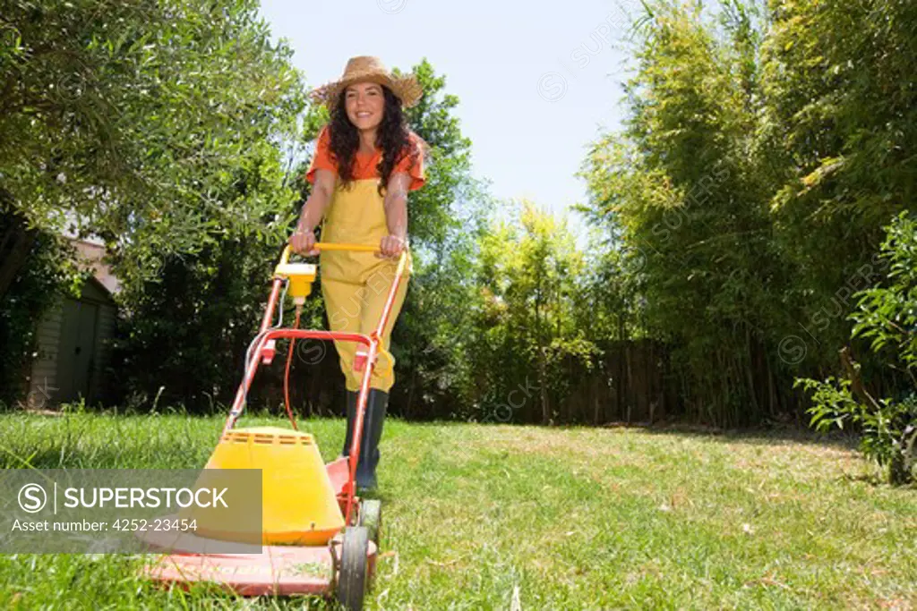 Woman lawn mower garden