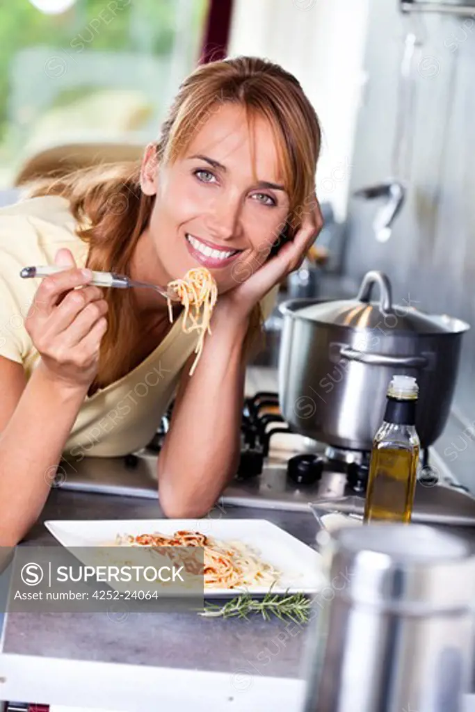 Woman cooking spaghetti