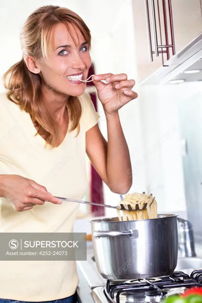 Woman cooking spaghetti