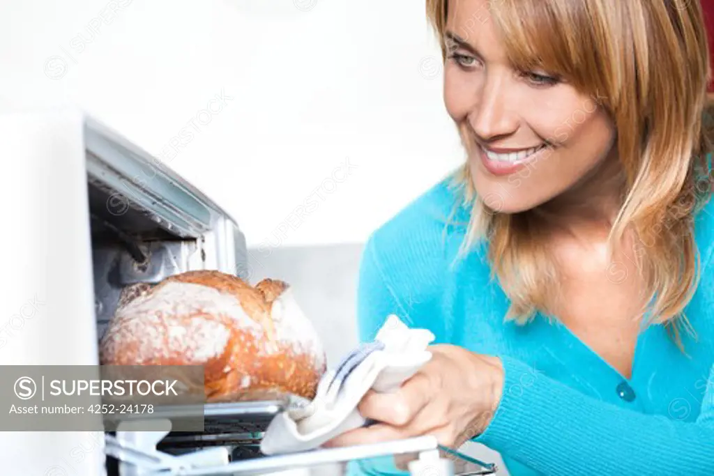 Woman bread oven