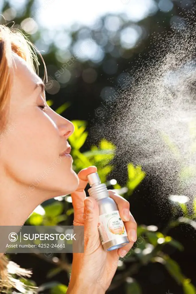 Woman essential oil spray