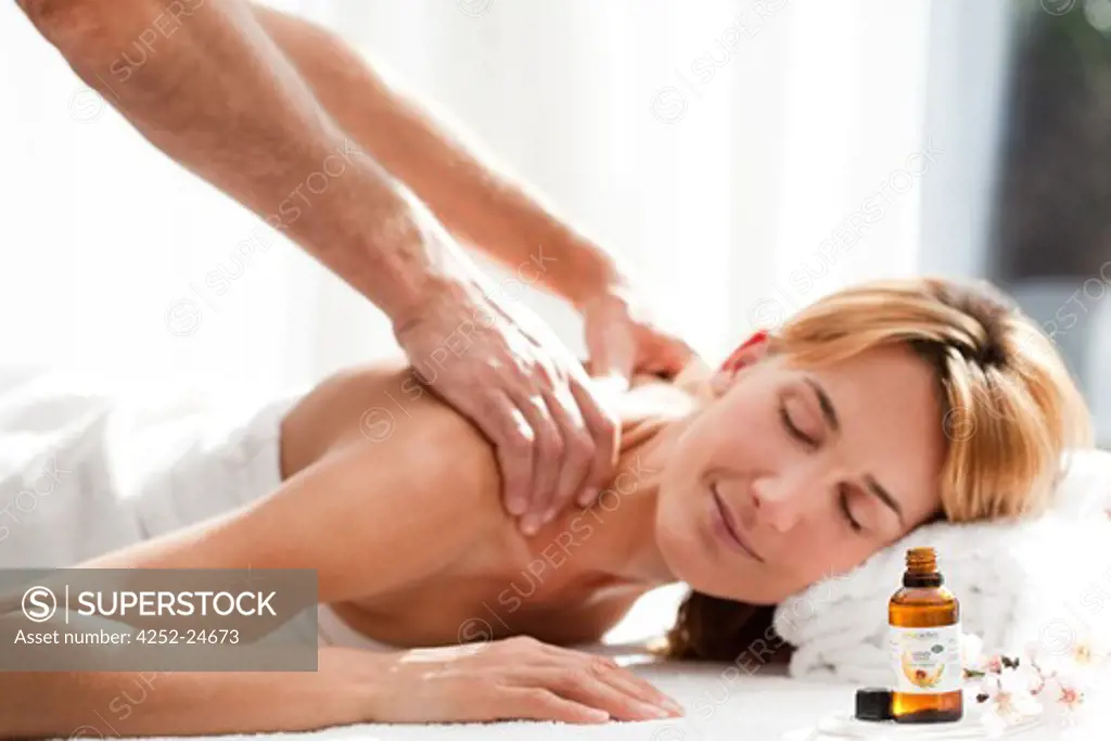 Woman massage essential oil