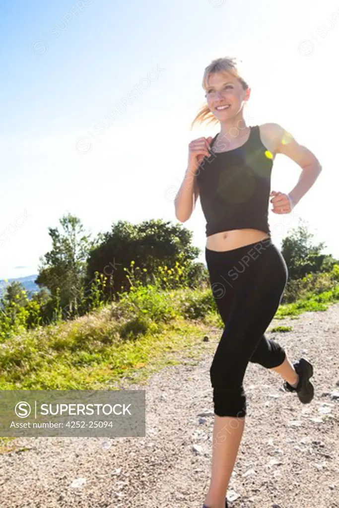 Woman jogging countryside