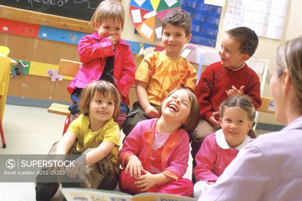 children inside girl group school joy boy laughing class teacher