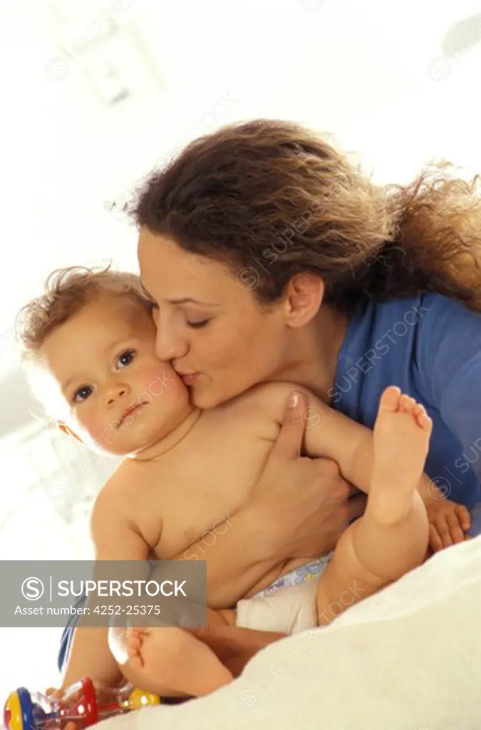 family inside woman baby child toy sitting mother tenderness kissing