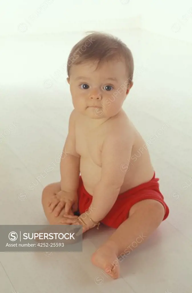 children inside portrait baby expression sitting look curiosity curious smiling well being