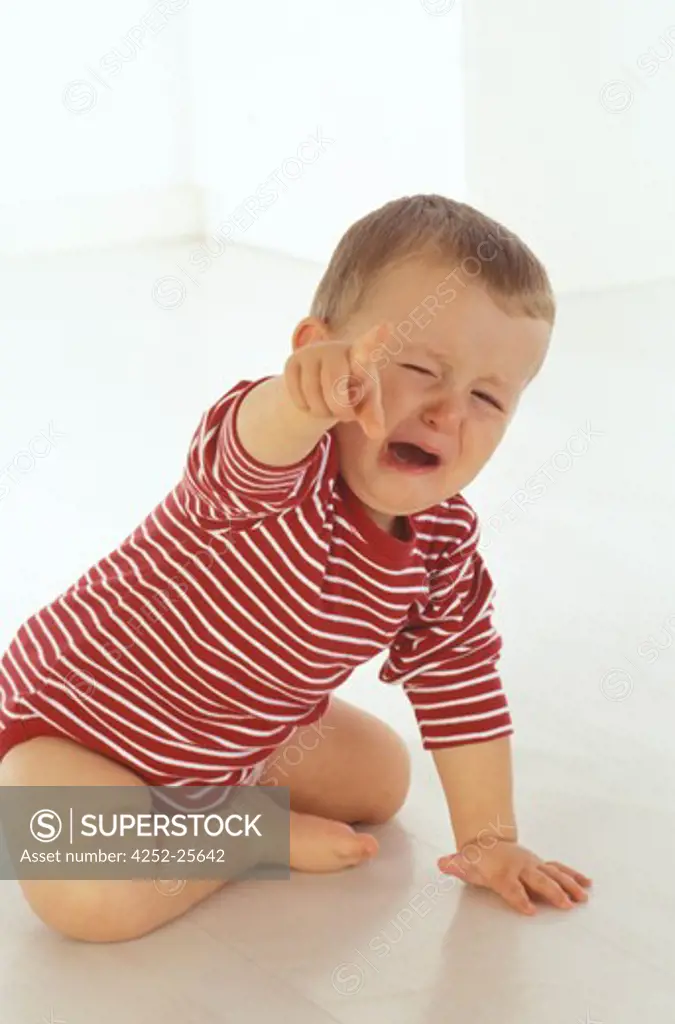 children inside baby sadness expression crying blond hair fall down movement hand shouting caprice portrait