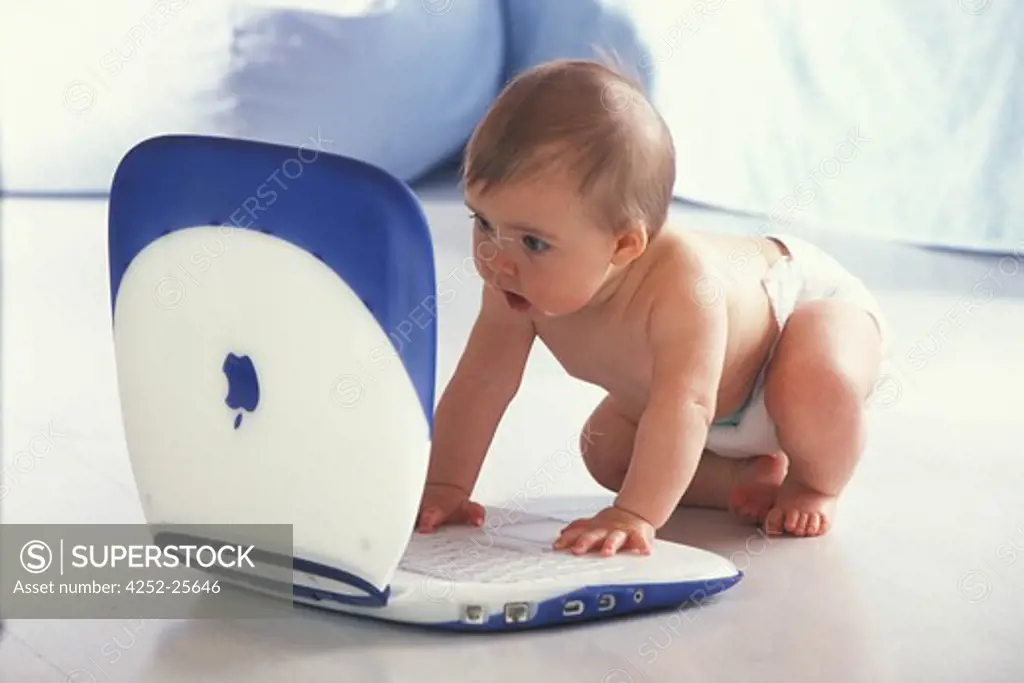 children inside computer baby expression nappy sitting discover questioning enjoy babble look happiness
