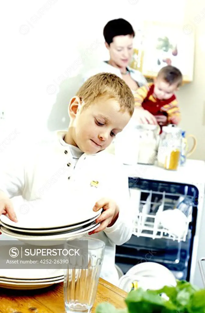 Child placing th crockery