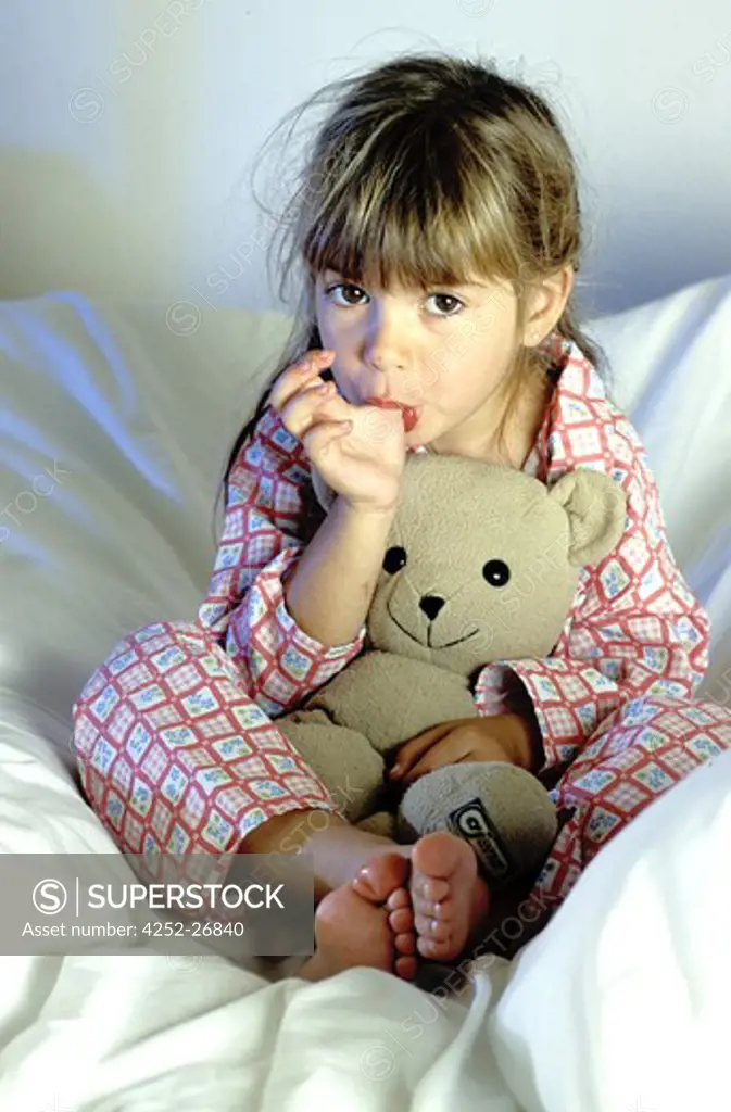 Little girl on a bed