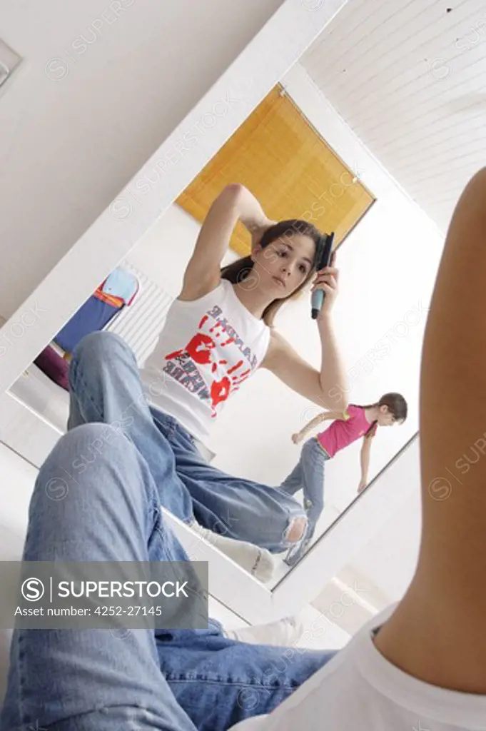 Young girl brushing her hair