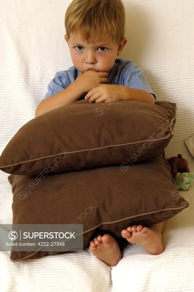 Little boy with pillows