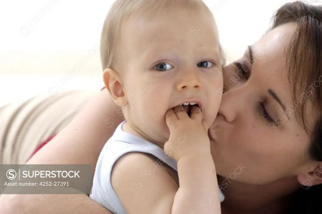 Woman kissing her baby