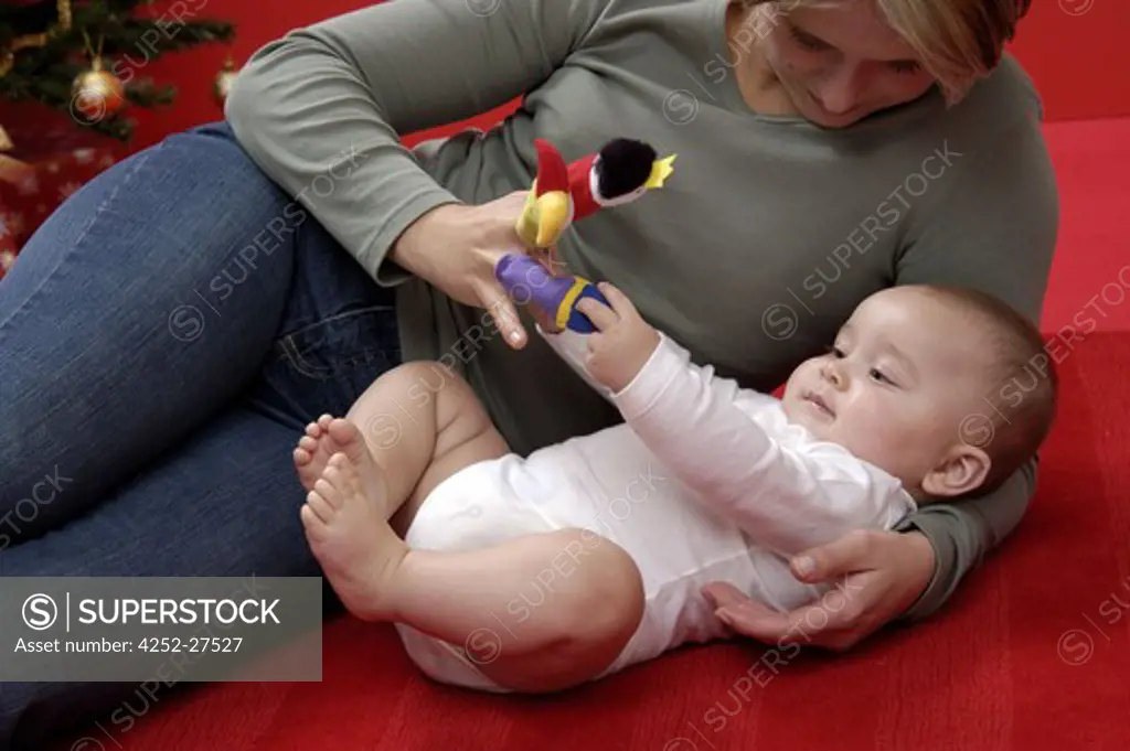 Woman playing with her baby