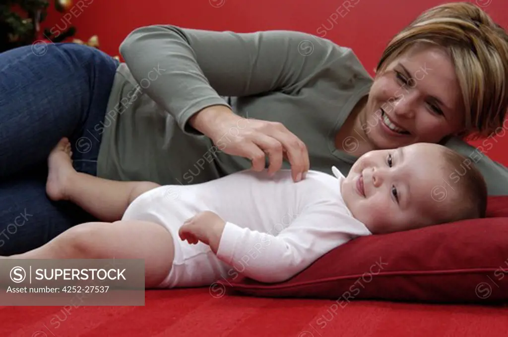 Woman playing with her baby