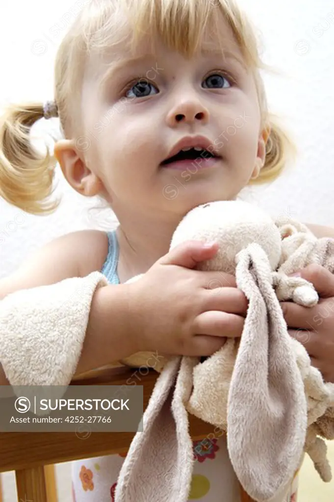 Little girl with a soft toy