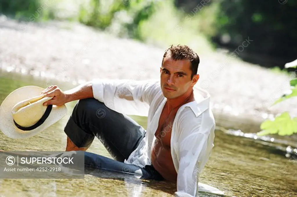 Man sitting in a river