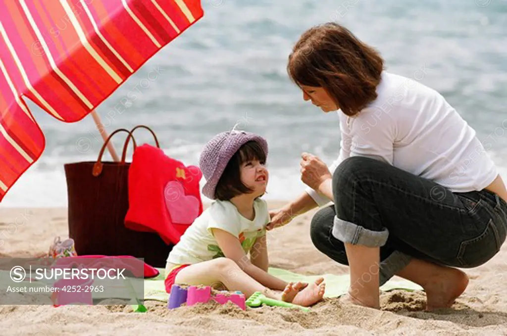 Woman and child on the beach