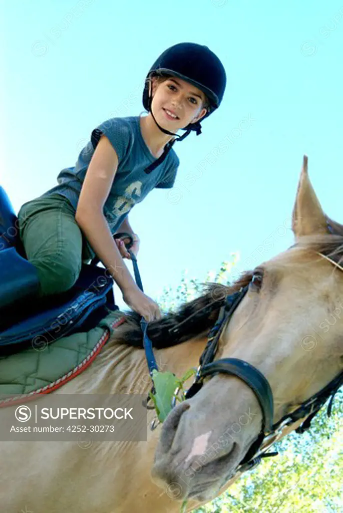 Girl horse-riding