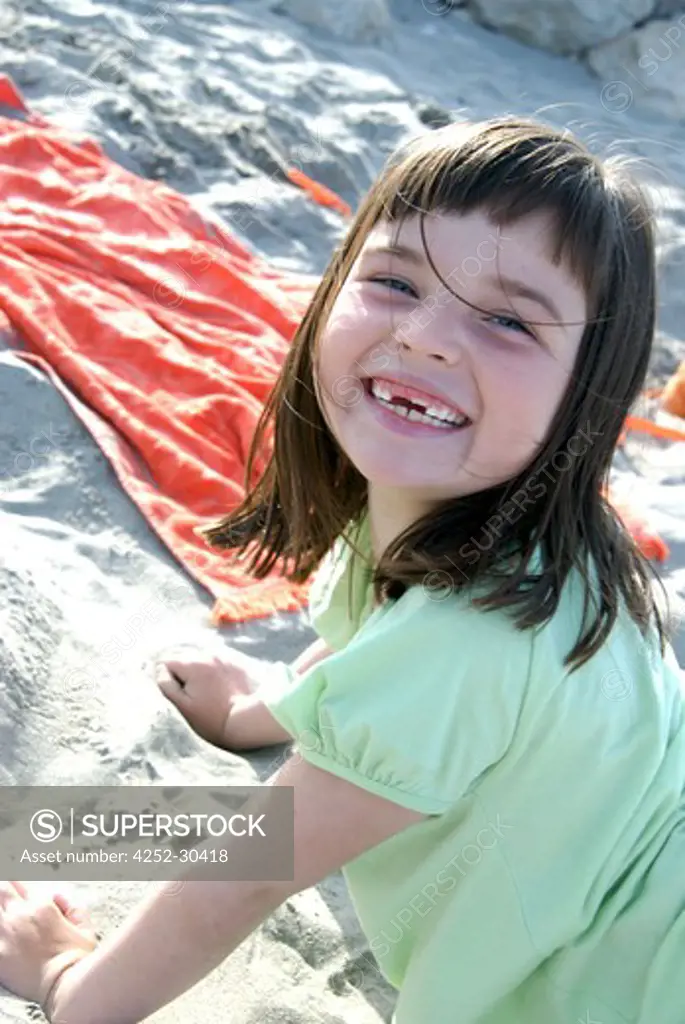 Little girl playing sand
