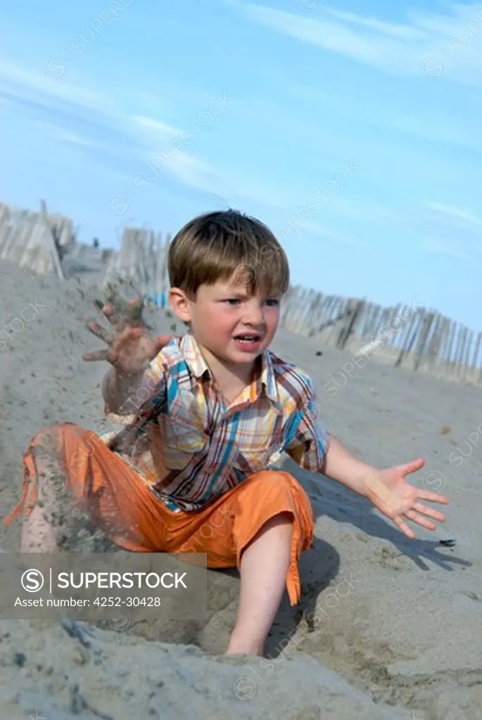 Boy playing sand