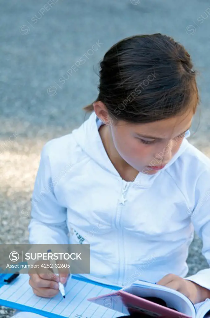 Little girl outdoor homework