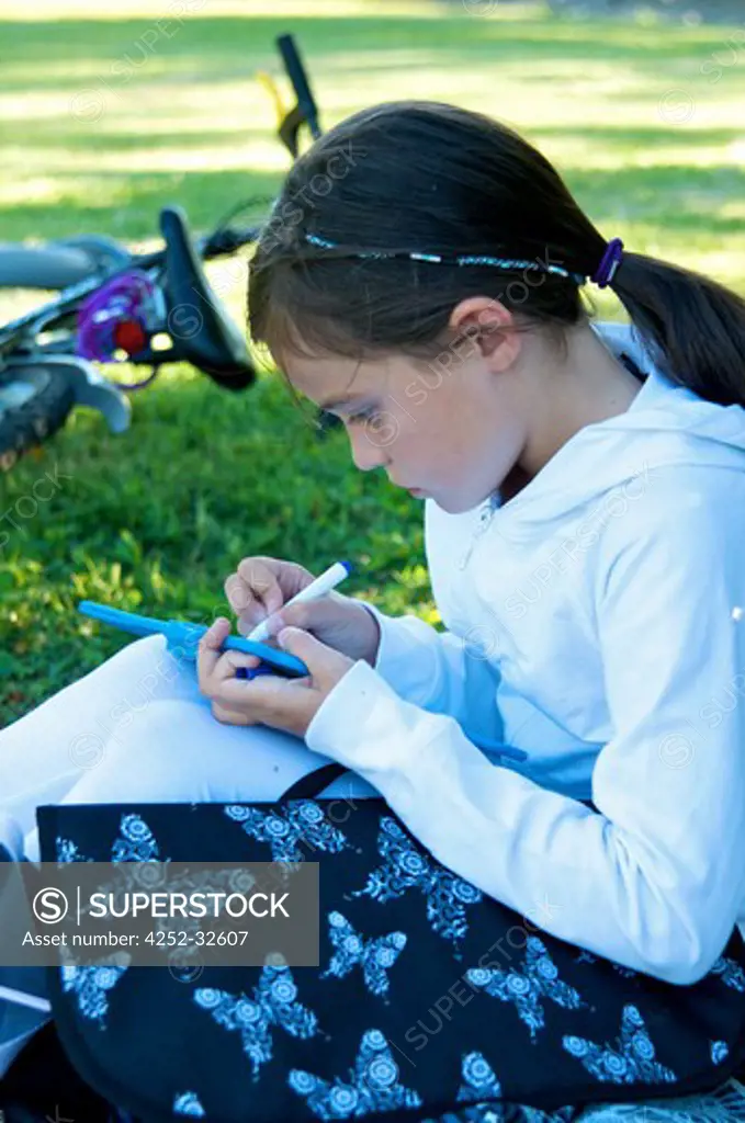Little girl outdoor homework