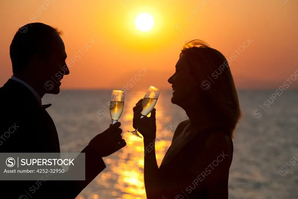 Couple champagne sunset