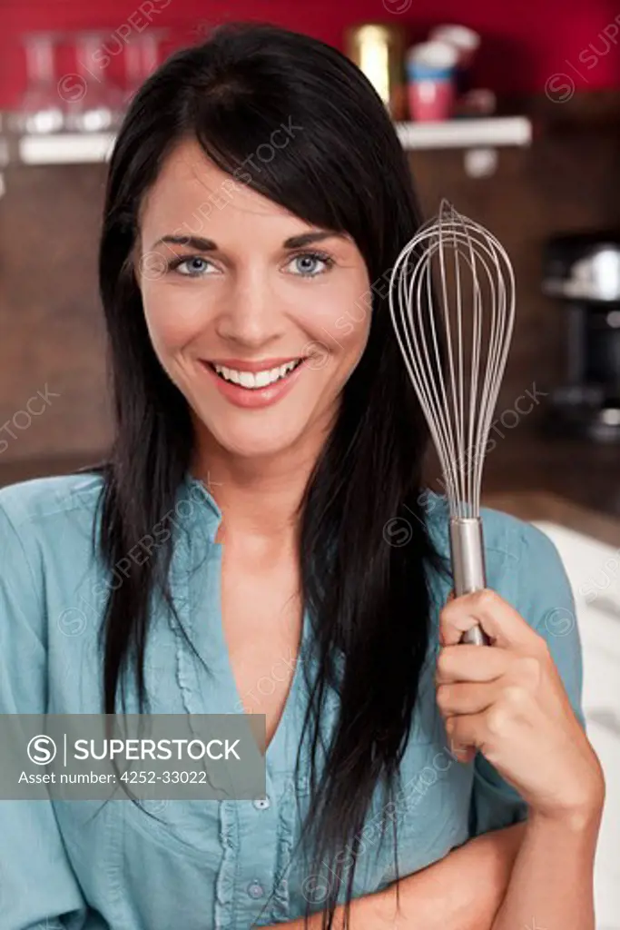 Woman kitchen whisk